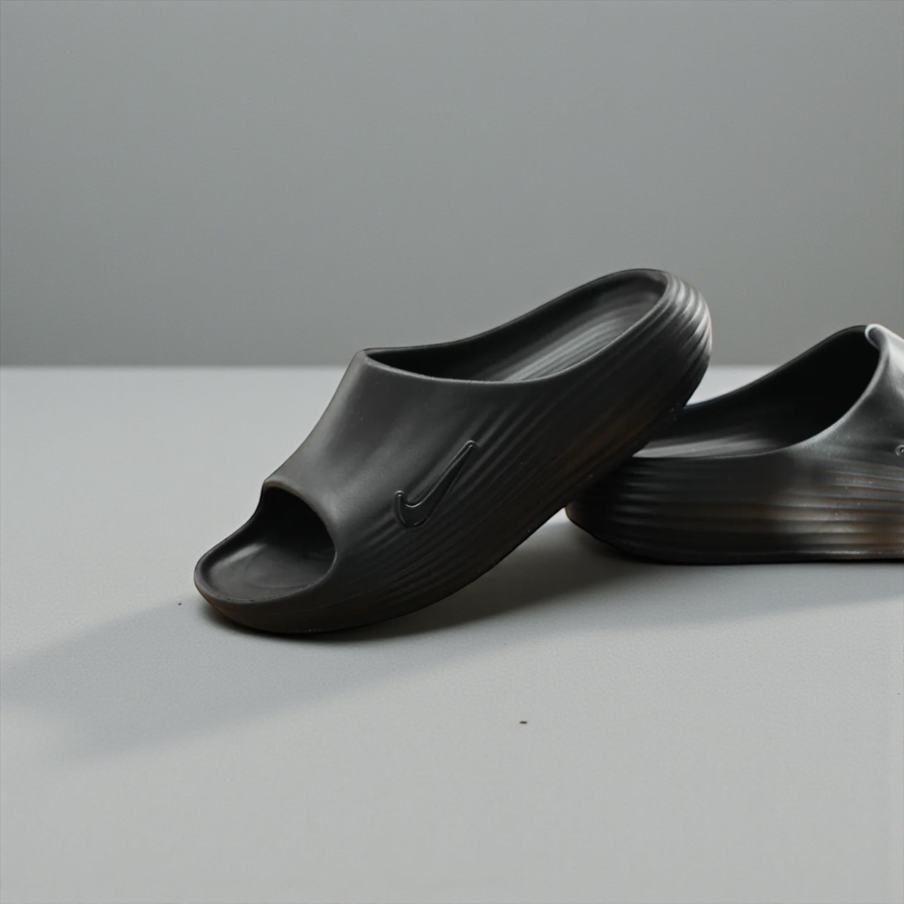 NIKE REACTX REJUVEN8 SLIDE "BLACK/BLACK-BLACK"