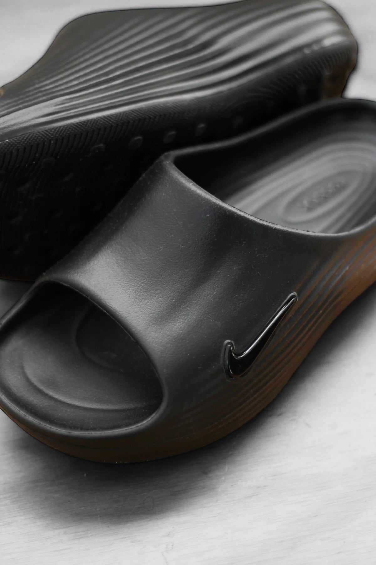 NIKE REACTX REJUVEN8 SLIDE "BLACK/BLACK-BLACK"
